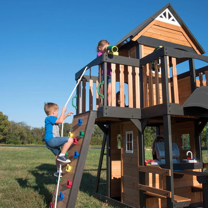 Canyon Creek Cedar Wood Swing Set with Wave Slide, Clubhouse, Play Kitchen, Picnic Area, Belt Swings, Web Swing, Rock Wall, Balconies, Playhouse, Step Ladder, Outdoor Playset